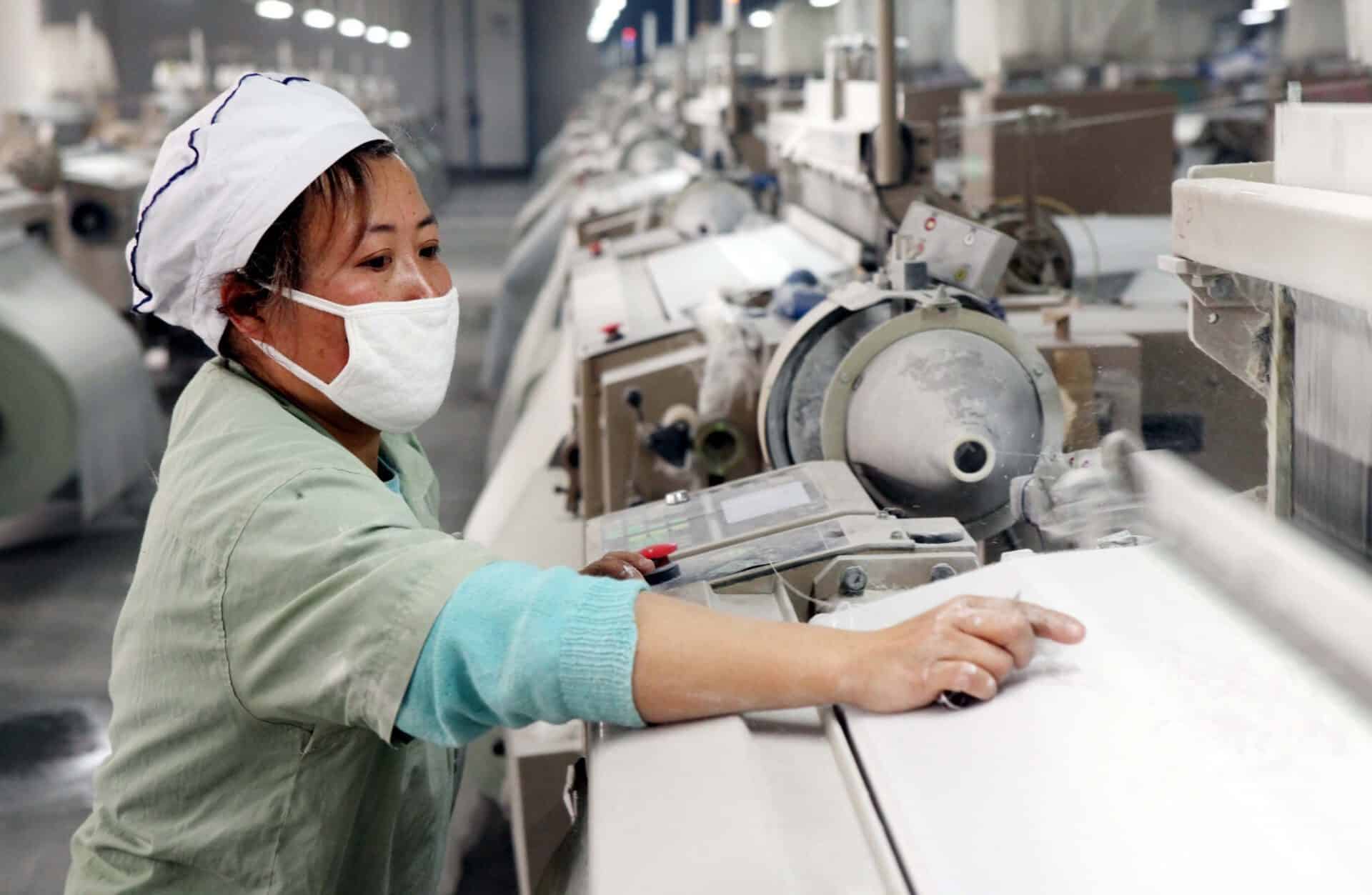 manufacturing operations female worker at machine