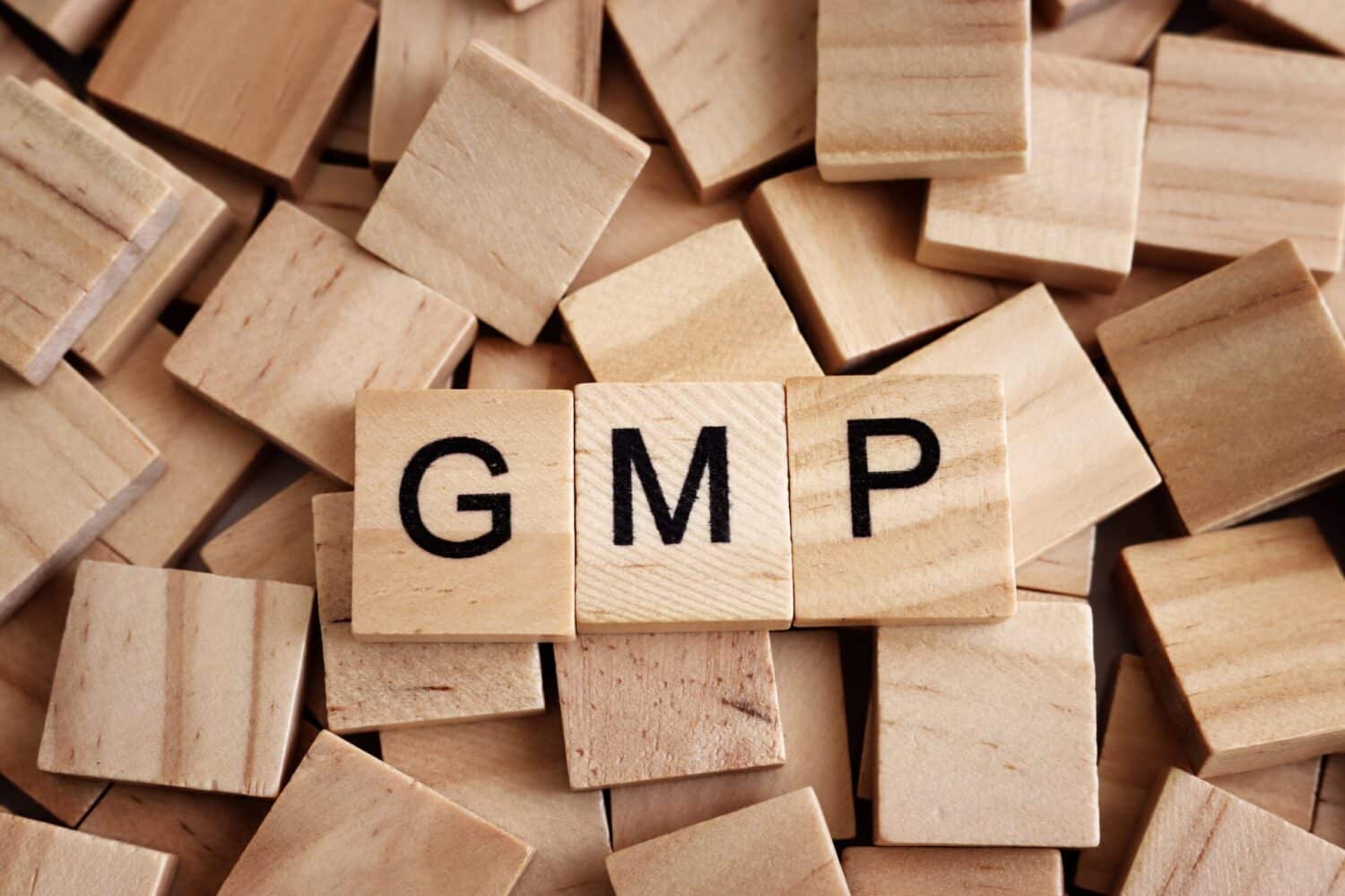 Tiles showing the letters GMP