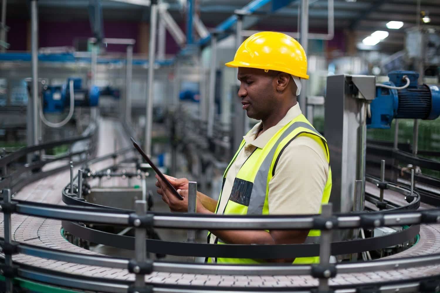 factory worker looking at a tablet