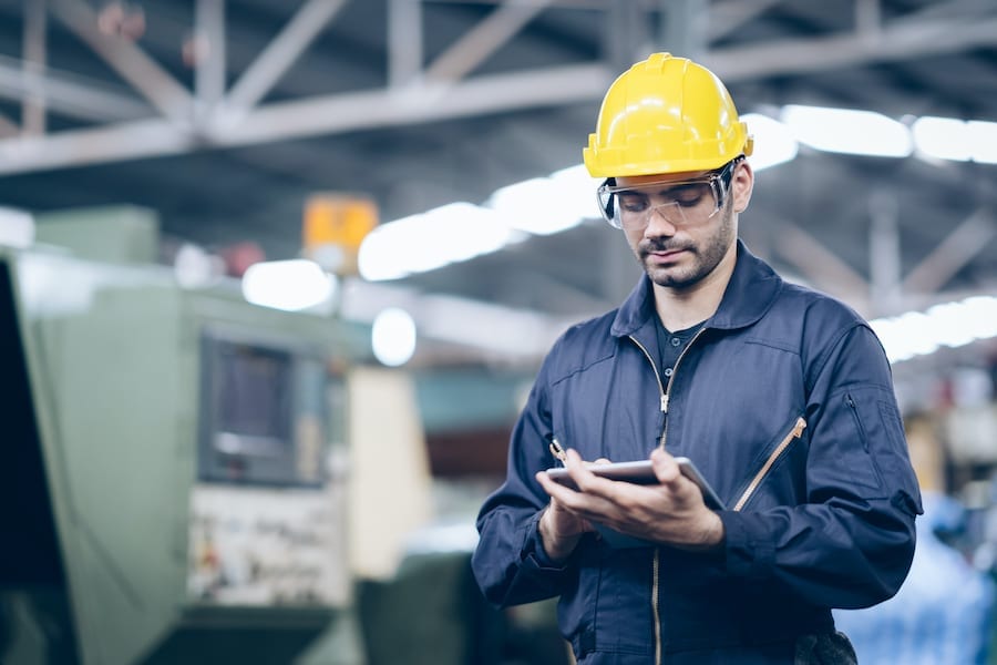 worker on tablet in factory