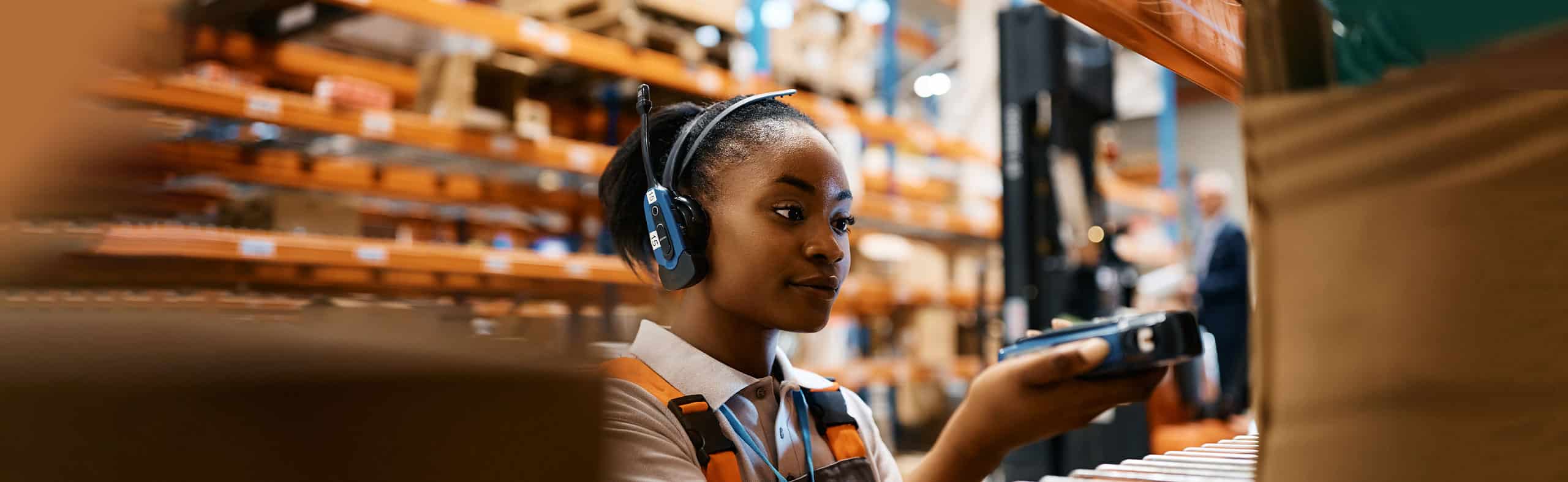 woman using wearable technology in warehouse