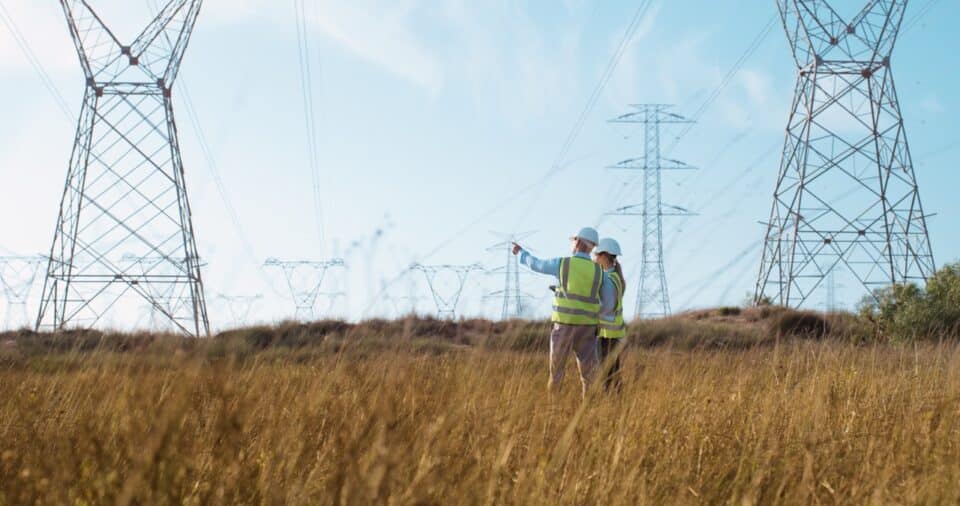 Electric-Utility-Workers-in-the-Field-near-power-lines