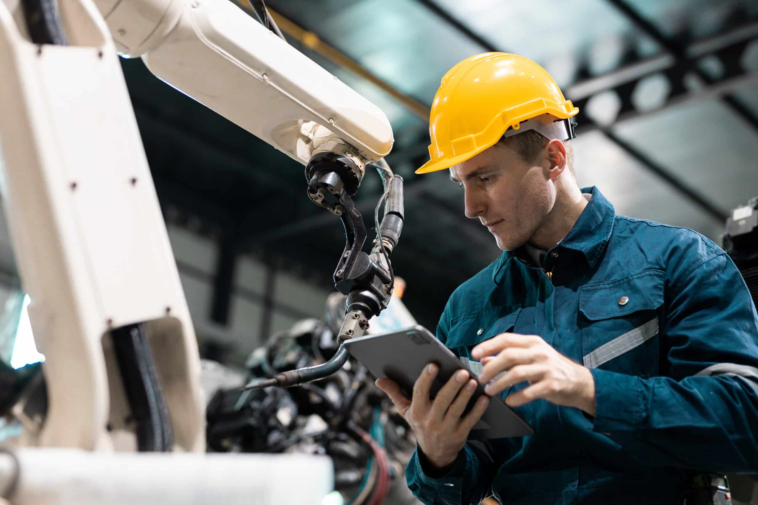 Man using Parsable on tablet to maintain production line