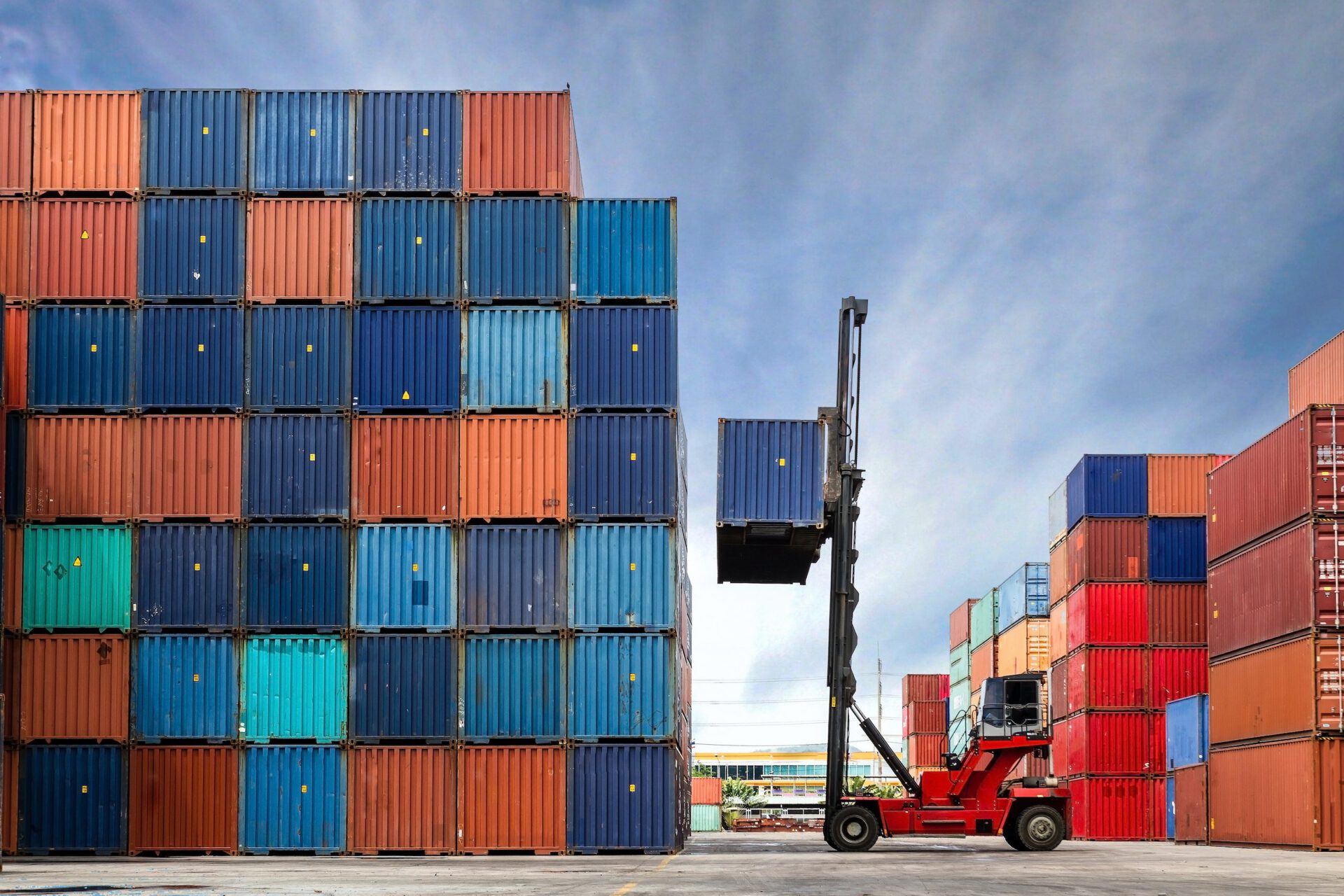 Stacked shipping containers and forklift