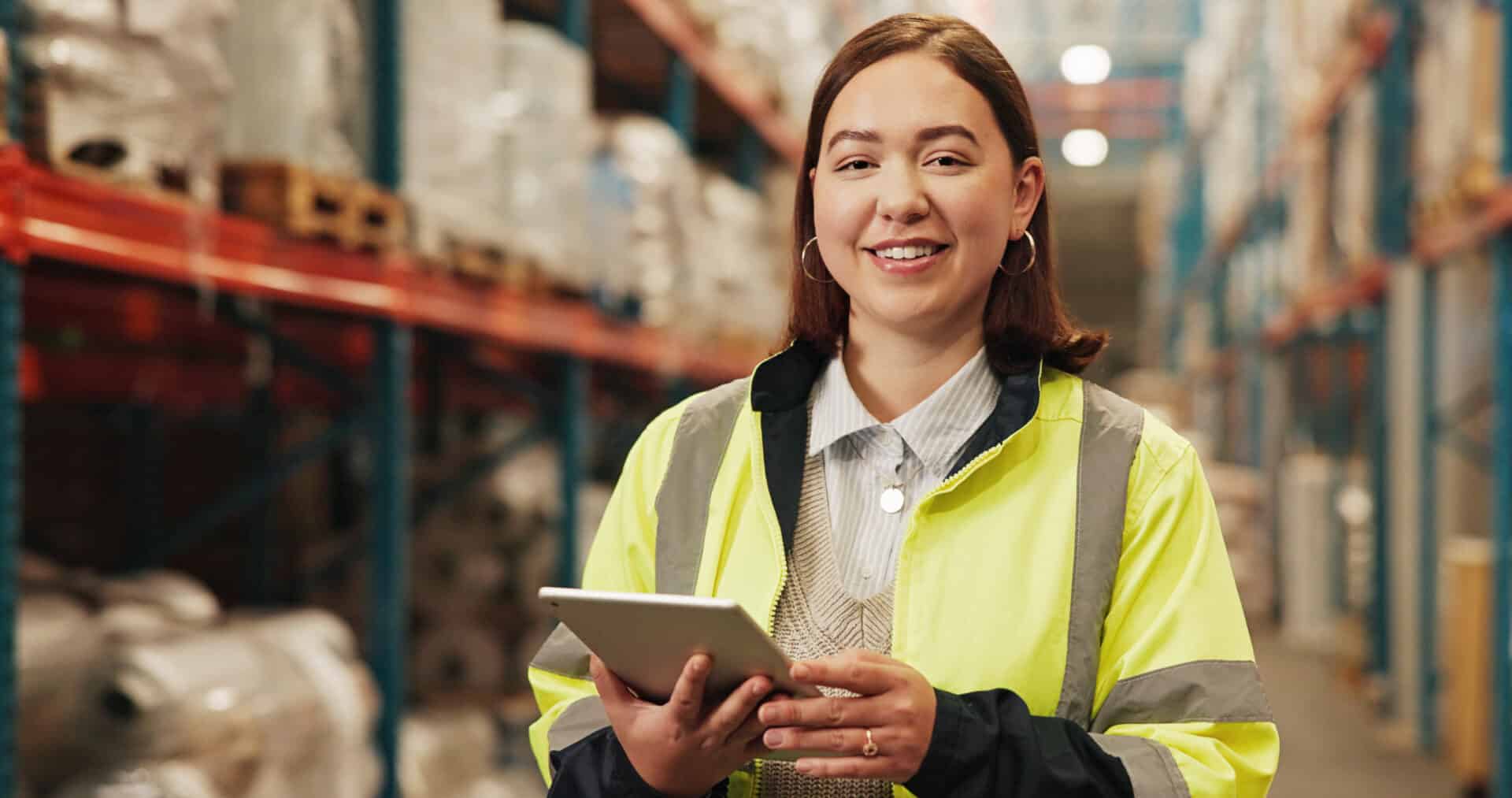 Logistics, woman and portrait with tablet in warehouse for quality assurance, stock check and inventory management. Shipping industry, supervisor and happy with digital app for factory inspection